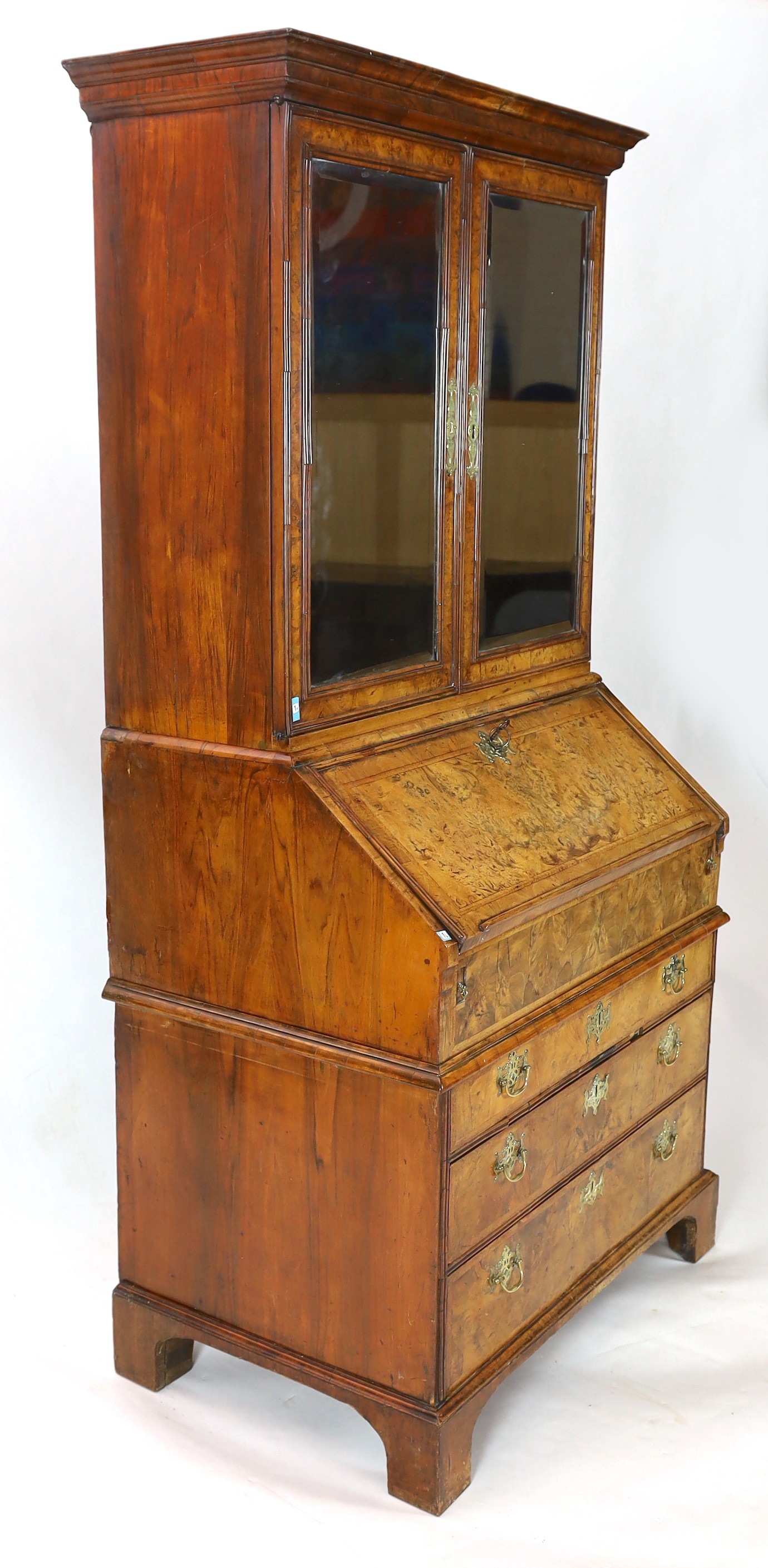 A George I walnut bureau bookcase, width 99cm, depth 62cm, height 196cm